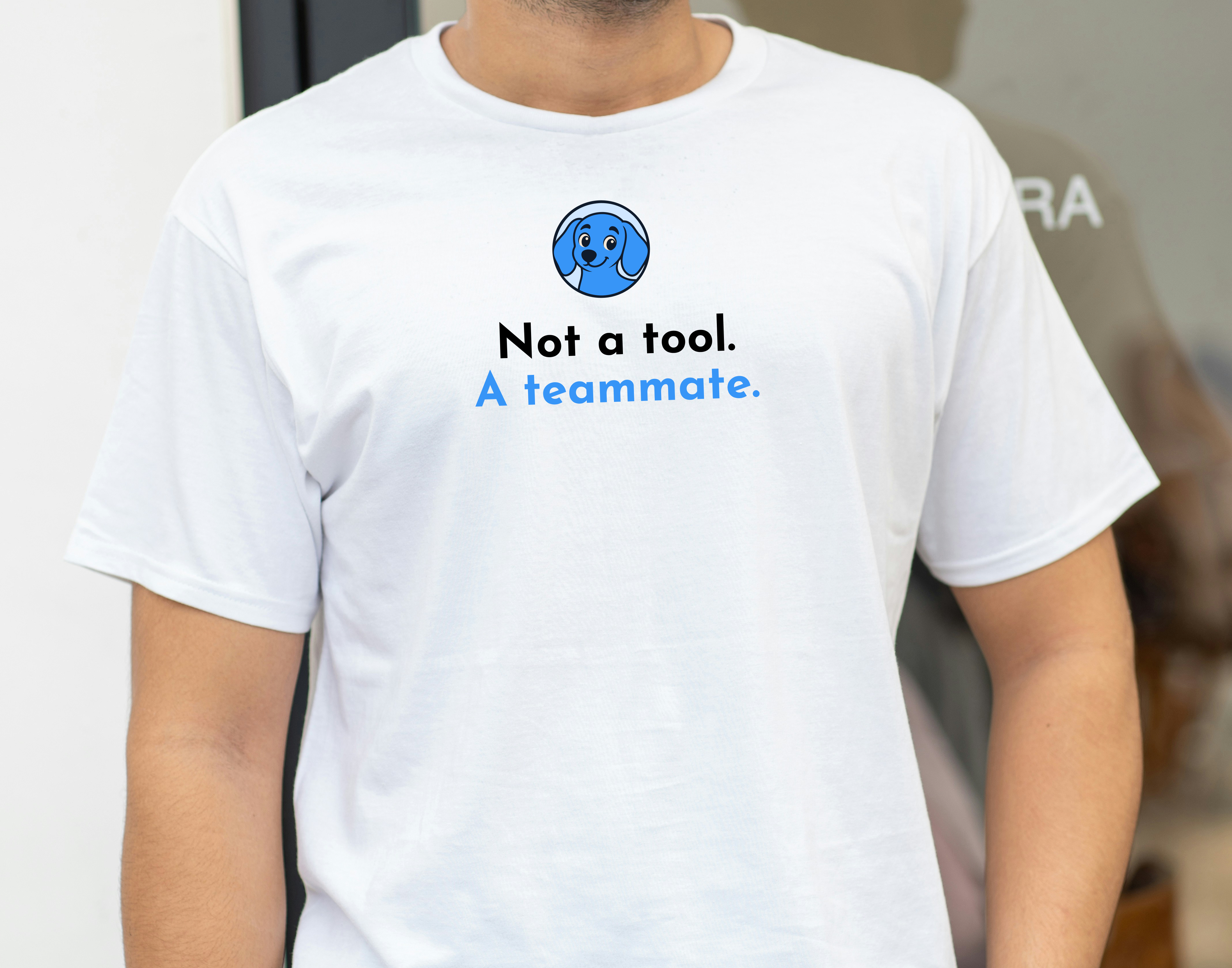 White t-shirt: Not a tool. A teammate. — front